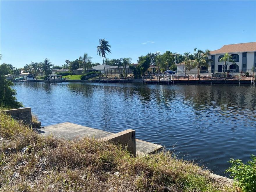 NEW LISTING!!! All assessments are paid!!!ATTENTION Builders Commercial Waterfront Lot with Gulf Access for sale.  
Now zoned commercial.  Buyer is to do their own due diligence regarding zoning and permitting.
Lot dimensions are 95' x 125' x 98' x 126' The property was recently cleared to open the view from the dock looking West down the canal. Located between Cape Coral Parkway and Veterans Parkway.