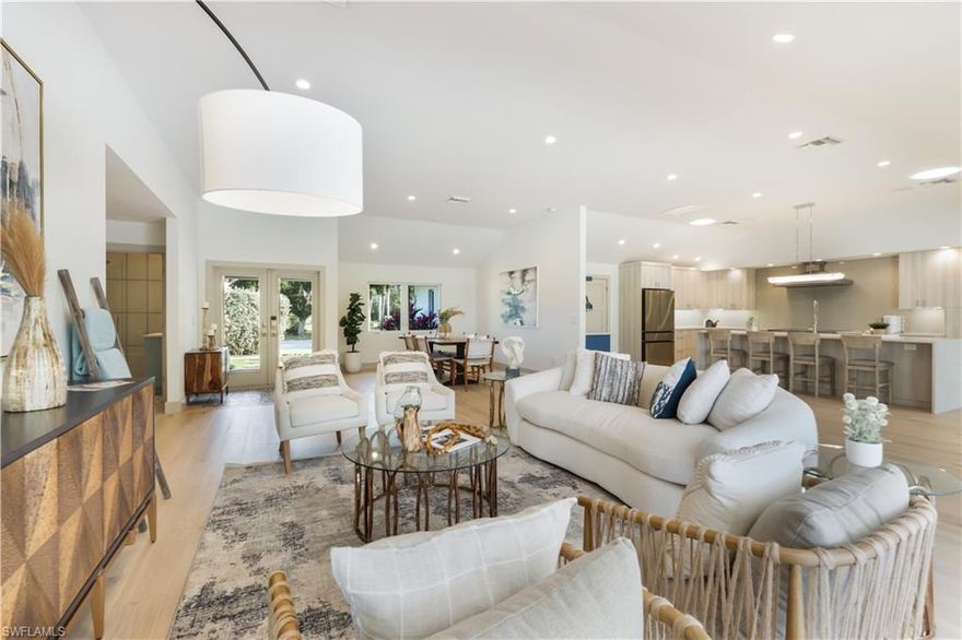 This waterfront property is ideally positioned on a navigable waterway with idyllic views of Outer Clam Bay and direct access to the Gulf of Mexico. The modernized floorplan was designed by MHK Architects in 2014 & was  renovated in 2023.  This single story residence features an open chef’s dream kitchen with a large center island, 48” induction range, large great room, 4 bedrooms, 3 bathrooms, impact resistant doors & windows, vaulted ceilings, hardwood floors & lovely earth tones to set the tone for relaxation and entertaining. A private “beach” &  boat dock offers 100 feet of water frontage and a great place for kayaks. Private outdoor lounge areas, covered dining and an outdoor kitchen allow for seamless indoor/outdoor living. Seagate is the ultimate neighborhood where you can live in a tropical environment w/ beautiful wildlife, yet be in walking distance to shopping & dining at Venetian Village & Waterside Shops. SeaGate Elementary, Gulfview Middle & Naples High School. Residents may choose to join the private Seagate Beach Club, which offers a pavilion, barbecue grills, changing rooms and parking. Natural Gas is available at the end of the street.