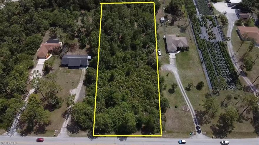 Almost 3 acres on Golden Gate Blvd East. Paved Road with easy access to east Naples and 951.