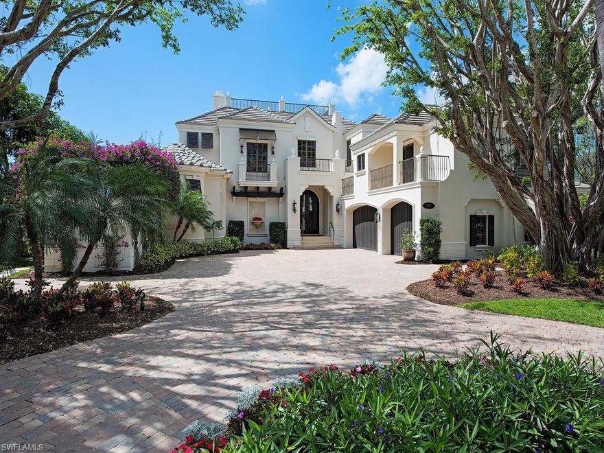 Enjoy the wide water views of this Custom Built Home. This unique home boasts water views from nearly every room. Walls of glass disappear for seamless indoor outdoor living. 
Beautifully updated.  There is a gourmet kitchen with Wolf range, grill, and warming drawer. Salt water negative edge pool with spa. The Lanai has motorized screens and shutters and an outdoor kitchen.   Other details include Fountain area with LED 5 Color lighting,  Custom Mahogany entry doors and 14" crown in the entry,  8" crown in other areas.  Port Royal Club Membership available.