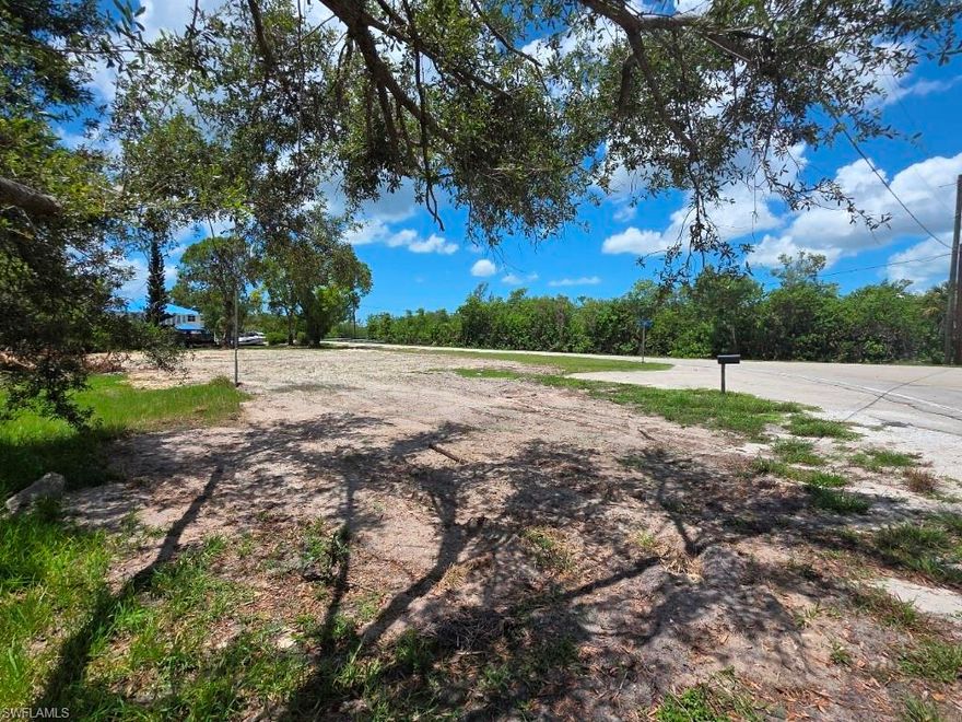 Build your custom home on over half acre (22,000 sq. ft.) corner lot with 110' of seawall plus boat ramp. Owner financing available at great terms. No impact fees on a home built on this lot. Any future home will have a spectacular sunset view of the Estero State Preserve.