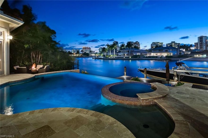 From the moment you open the grand iron Acadian front door, a superb western view of Venetian Bay greets your eyes. Expertly balanced design elements are paramount in this recently built custom home. Incorporated in a single level, you will find a host of superlative features, from custom millwork, eight-foot solid core doors, custom crown moldings and baseboards to natural stone and hardwood flooring, quartz and onyx countertops and first-class appliances. The gracious master bedroom is well designed with closets that are finished to perfection with custom mirrors and granite. Use the separate sitting area next to the master bedroom as a private media room, office or nursery. The outdoor living space is paradise found with a luxurious travertine pool deck presenting various dining and conversation spaces and a gourmet outdoor kitchen and bar area including an alfresco grill and hood and under-counter refrigerator; gather around the fire pit, dining table or dangle your feet over the dock and savor the setting sun. An impeccable property for the discerning buyer. Make it yours today.