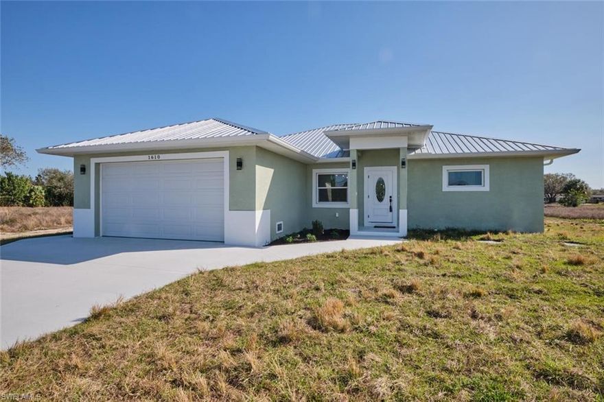 Welcome to your dream home in a tasteful country setting close to the Alva area! This stunning new construction custom-built Florida-style home offers 3 bedrooms, 2 bathrooms, and 1,836 sqft of luxurious living space on a spacious half-acre lot. Featuring impact windows and doors, a durable metal roof, and luxury vinyl flooring throughout, this home is built to impress. The great room concept boasts soaring cathedral ceilings in the living area, 8'8" flat ceilings throughout, and a 9'8" tray ceiling in the owner's suite, creating an open and airy feel. The gourmet island kitchen is equipped with quartz countertops, a Frigidaire complete appliance package, and is perfect for entertaining. Enjoy outdoor living with a spacious under-truss porch, perfect for relaxing or hosting gatherings. The oversized 22x23 two-car garage offers ample storage and workspace. The home's foundation is built on a durable stem wall system with concrete block construction, ensuring lasting quality. Additional highlights include a tankless water heater, in-residence washer/dryer hookups, and thoughtful custom finishes throughout. This is a truly exceptional property that combines style, quality, and modern convenience – don’t miss your chance to call it home!