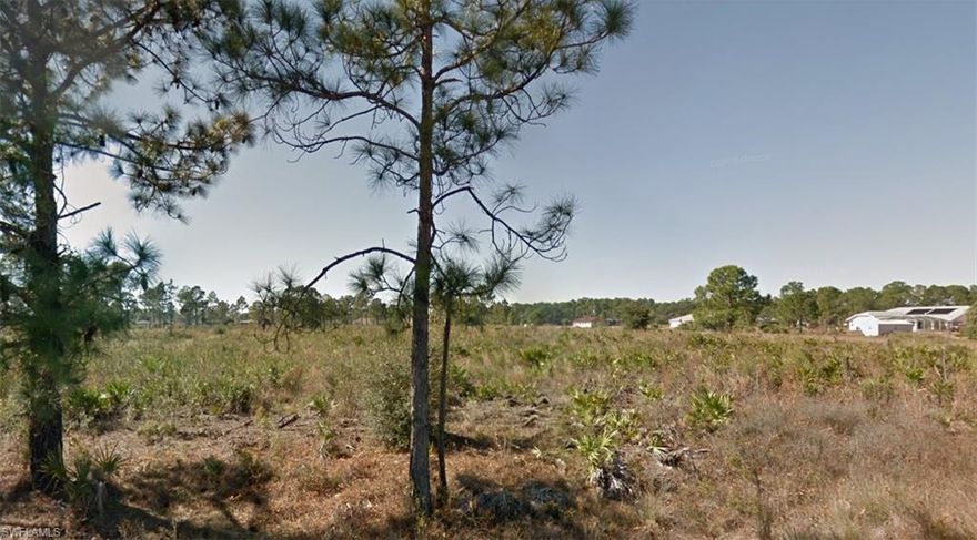 Wooded half acre lot in residential area, paved road access. Build your dream home - close to shopping and schools.