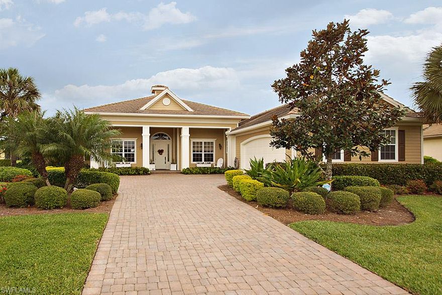 EXTREMELY WELL MAINTAINED CUSTOM BUILT HOME BY WYMAN STOKES.  This home is freshly painted and has crown molding, granite counters, custom tile in the foyer and a huge tray ceiling in the main living area.  The kitchen has elegant back splash, a large center island w/a built-in wine frig, custom cabinets and a warming drawer .  The large lanai boosts a beautiful swimming pool (with a hot tub) an outdoor fireplace and a gorgeous view of the water.    Electric hurricane shutters and hurrincae rated windows outline the home while an outdoor fireplace and large outdoor undercover area allows you to enjoy all the outdoor living in the sun or under roof.  The Verandah has two 18 hole golf courses, tennis, kayaking, 9+ miles of biking and walking trails and is minutes from water skiing, boating and fishing.  This is a great home in a wonderful community!