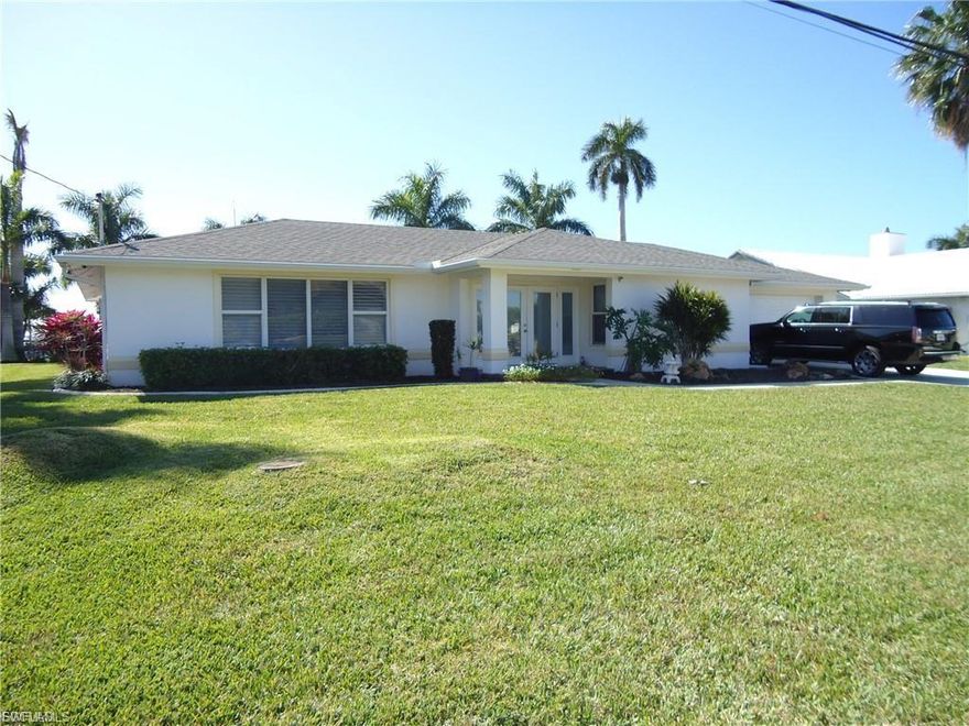 Beautifully remodeled custom pool home in the Desirable Orchid section of Cape Coral. Great location for the avid boater. Only minuets to the river. Large dock with a 27K LB lift and a slip with pilings to accommodate a larger boat. Large oversized triple lot with southern exposure and almost half an acre 120x150 with beautiful tall palm trees and mature landscaping. This home is a must see if you are looking for amazing water views, beautiful view of the river as well. The annual 4th of July fireworks display is literally in your back yard. Make your appointment today to see the beautiful home. No water intrusion from past hurricanes
