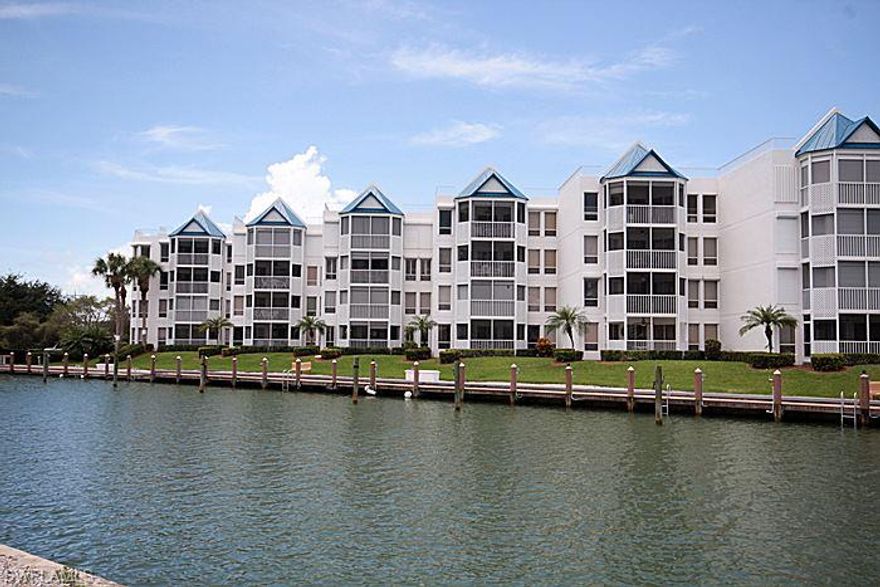 Rarely available private top floor END location & incredible bay view! Impeccable interior with 18” tile on a diagonal, completely updated kitchen featuring maple cabinetry, quartz countertop, new wine cooler and dining room with custom built-in matching the kitchen. Beautifully updated baths. California closet. Deeded boat slip/lift with quick access to the gulf! Fully shuttered-electric on rear, manual on front.  Assigned covered parking.  Social friendly complex.