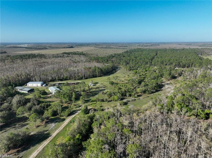 Are you seeking the ultimate serenity, combined with the convenience of proximity to shopping, dining, recreation, and much more? This 86-acre property is the real estate opportunity you've been searching for. It features two workshop areas, a horse/chicken barn, and a partially completed 4-bedroom/3-bathroom residence. Enjoy private views of Florida's lush landscape and a private lake from the back porch. Take leisurely walks along the property's private, unobstructed walking trails/roads. Situated adjacent to an area experiencing booming growth, this property offers a serene atmosphere, breathtaking views, and an abundance of wildlife. This property includes a 40x100 utility barn, 40x75 commercial shop, and 40x100 lodge with residential quarters. Schedule a showing today.