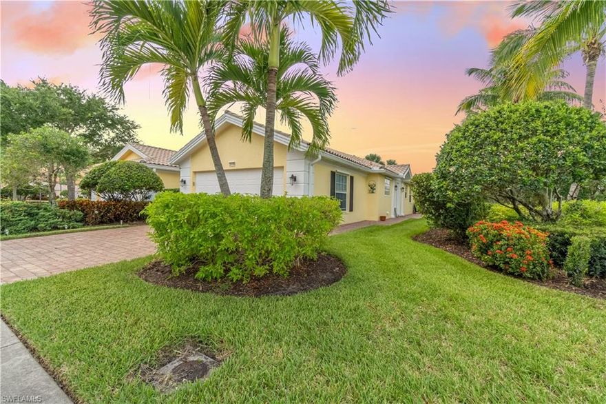 WELCOME HOME! This charming villa located in Village Walk is bright and has a tropical. The popular Capri model boasts 2 bedrooms 2 bathrooms + an open den. This home feels open and roomy with vaulted ceilings in the main living areas, and volume ceilings in the bedrooms. Nicely updated with porcelain tile and laminate wood flooring in the bedrooms. The beautiful kitchen has stainless steel appliances, solid counter tops, and large breakfast bar able to accommodate multiple people. Like storage space? There are two walk large walk in closets, master hallway closet, two linen closets,  and laundry room with cabinet space. Not only does this come with a two car garage, but also impresses with epoxy flooring and a central vacuum. This home has beautiful appeal with lush landscaping, brick pavers, and as you step onto your lanai you are met with a gorgeous lake view.