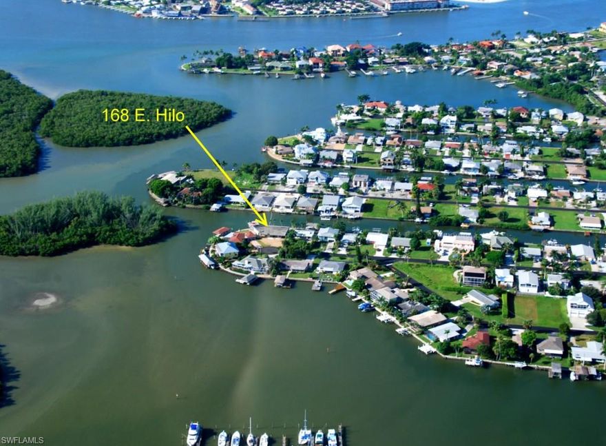 Duplex (2BR/2BA and 1BR/1BA) with 119' feet on deep sailboat water. Remodel or replace. Covered boat dock & lift with running water and electric.    2 carports, 3 screened porches, 1 exterior + 1 interior laundry room.  This is a great location with plenty of potential!  Live in one side and use the other for family & friends or rentals!  Build up for even more commanding view!  Although zoned RSF-4 (single family), use code reflects multi-family. Interior photos and more room dimensions to follow shortly.