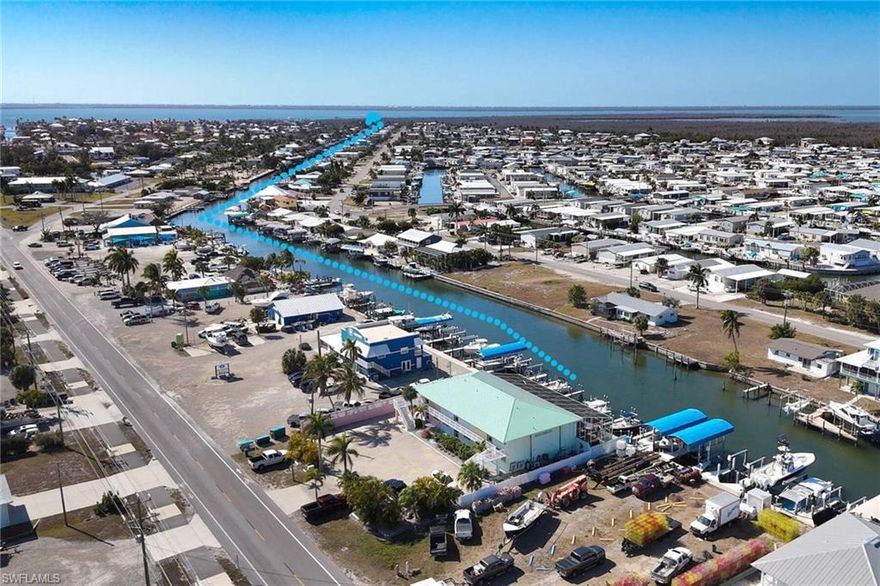 Direct Gulf Access... Short Distance to Open Water and the Intracoastal Waterway. This First Floor Corner Unit has been Beautifully Updated with Light Floors, Kitchen and Decor! It is being Sold Turnkey.... All you need is your tooth brush! It Has a Newer Metal Roof, AC, Docks, Lanai and is Freshly Painted! Step Outside Your Back Door and Enjoy the Sunsets from the Screened Lanai and Heated Pool. Go Down to the Docks and Fish or Boat to The Beaches of Sanibel, Captivia, Ft. Myers Beach, Cabbage Key or Cayo Costa State Park.  Kayak through the Canals and Enjoy the Best Island Life has to offer. Great Restaurants, Great Sunsets, Bars and Beautiful Wildlife! See Dolphins, Manatees, Birds and Enjoy World Class Fishing! This Unit has Impact Windows and Doors that were Recently Installed. Community Washer, Dryers and Bike Racks. Extra Storage for Your Convenience. Excellent Opportunity to Own a Piece of Paradise Today!