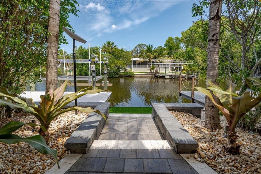 Lot 19 - Welcome to your slice of canal front paradise with indirect Gulf access! This property offers full pavers, a huge tiki with custom tiles, a huge fan, an oversized dock for additional entertaining space, and a boat lift. This property offers all the privacy you could want with its thoughtfully designed entertaining spaces. Your extra large tiki is at the rear of the property where you can entertain or just sit back and relax and it comes fully furnished including TV! In the evening, you go to your oversized dock and relax with friends as you watch the sunset. The dock is a perfect second entertaining space as you look at the beautiful mangroves. Wildlife continually fly by or swim by, including manatees! But wait.... you pack the snacks and refreshments of your choice and lower your boat from the boat left and set off for the Gulf of Mexico, or perhaps Naples and Gordon Pass or fishing along the 10,000 islands.... With indirect gulf access (bridge) all options are yours. Come tour this property today and see all it has to offer. Naples Motorcoach Resort is a Class A only resort and boasts a beautiful infinity pool, hot spa, exercise room, men's and ladies saunas as well as a kitchen that owners can use. There are also two satellite pools with a hot spa, their own rest rooms and a laundry room. We can't forget your furry best friend, the resort even has a dog park! Special note to investors, looking for a place to invest or reinvest as a 1031 exchange? Look no further, own this piece of paradise and put it into the management run rental program. The rental program administration advertises, schedules renters, collects payment including applicable taxes/fees and sends you your portion. These deeded lots are mortgage eligible and great for a quick close.