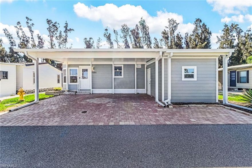 Welcome to Pine Island Cove your dream retreat in the vibrant city of St. James, where serenity meets convenience! This delightful property is nestled in an active HOA non-gated 55 park, offering a tranquil escape with its view of a small canal leading to the lake. Enjoy the finest in community living with access to a community boat ramp for direct Gulf access, a welcoming clubhouse, and a refreshing pool, plus extra boat storage parking for just $50 a year. This beautifully furnished home boasts modern conveniences with all appliances included, a newly installed roof, carport and hardy board siding, promising durability and style. With parking for two cars under the carport, you'll love the ease of access to nearby shopping and restaurants. Embrace the Florida lifestyle as you relax on your lanai. While being mere moments away from the heart of the action. This property is not just a home, it's a lifestyle waiting for you to enjoy!