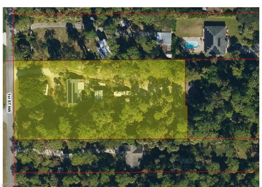 OPPORTUNITY KNOCKS with this high-potential diamond in the rough! Situated on 1.64 acres of 100% UPLAND land this 4-bedroom, 3-bathroom concrete-block pool home is the ultimate project for an investor or smart buyer ready for a rehab project. roof 2023 with Solar Panels.  Located West of Wilson Blvd on 1st ST NW, you are in one of the most desirable pockets of the Estates. Solid concrete block structure. Massive LOT that maximizes  1.64 acres of dry, usable land (No wetlands!). Beat the crowd! This is an "as-is" sale. Investors, bring your vision to secure this property.