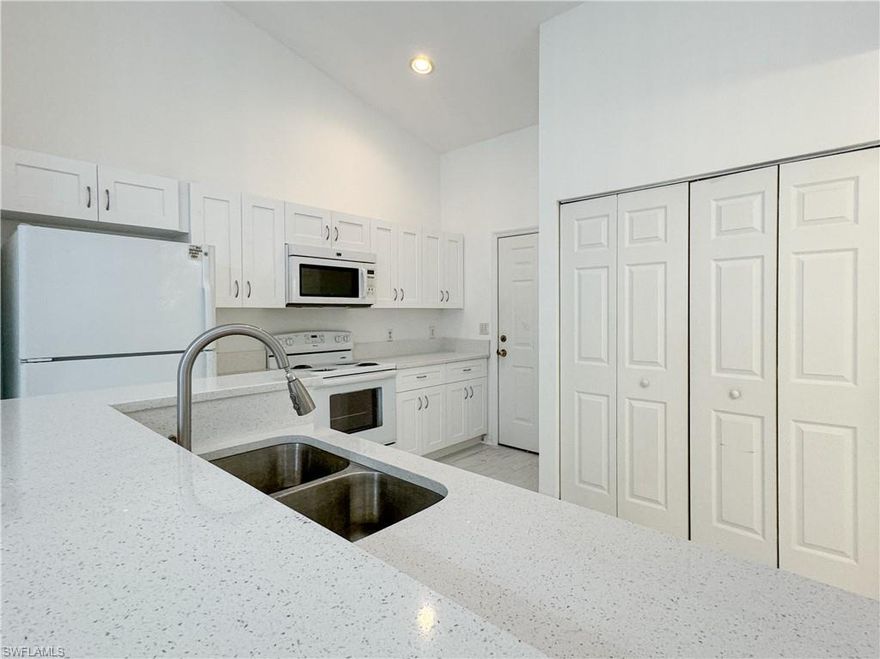 Experience the best of Naples living in this charming first-floor attached villa featuring 2 bedrooms and 2 bathrooms. Vaulted ceilings create a bright, open atmosphere, while updated laminate flooring adds warmth and style throughout the main living areas. Enjoy peaceful mornings and stunning western sunset views from the screened lanai overlooking beautifully landscaped grounds.

Located in a quiet residential community, this home offers the perfect blend of comfort and convenience just minutes from Olde Naples, downtown dining and shopping, and the pristine beaches of the Gulf of Mexico. Vista Gardens provides an exceptional opportunity to enjoy the Naples lifestyle at an incredible value.