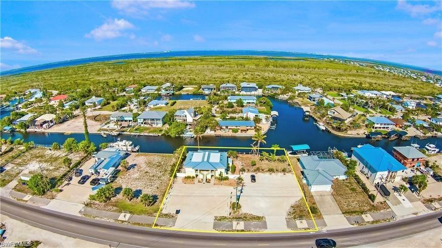 We are proud to bring you this stunning 8-unit apartment building - a rare gem that combines modern comfort with a prime waterfront location. Offering an unmatched investment opportunity, this property is perfect for both seasoned investors and those looking to expand their portfolio in a thriving market. Property Features - Prime Waterfront Location: Boasting 161 feet of frontage on a gulf-access canal, this property offers direct access to the Gulf of Mexico. The dock, spanning the entire length of the property, is perfect for boating enthusiasts and provides ample space for multiple boats. - Renovated Units: Six of the eight studio apartments have been completely renovated in the past 24 months, featuring new flooring, updated kitchens and bathrooms, and modern finishes. The remaining three units have been partially updated, offering a mix of classic charm and contemporary amenities. - Flexible Leasing Options: The property offers a unique blend of rental opportunities. Four units are currently leased on an annual basis, providing stable, long-term income. The other four units are listed on Airbnb, generating substantial short-term rental income. Detailed financials are available. - Fully Furnished: All units come fully furnished, providing a turnkey solution for investors. The tasteful decor and high-quality furnishings enhance the living experience for tenants and guests alike. - Expansive Waterfront Deck: The massive deck is a true highlight of the property, furnished to accommodate parties, get-togethers, or quiet relaxation. Whether it's enjoying the sun, hosting a barbecue, or watching the dolphins and sunsets, this space is perfect for creating memorable moments. - Ample Parking and Pet-Friendly Yard: Situated on a 0.44-acre lot, the property offers abundant parking space, eliminating any concerns about crowding. The fenced yard is ideal for residents with pets, providing a safe and enjoyable area for dogs to run and play. - Complete metal reroof completed in 2025, ensuring the building remains in top condition for years to come. - Modern Amenities: Each unit is equipped with new mini-split air conditioners, providing efficient and reliable cooling. The property also includes secured bike parking, a maintenance shed, and a cleaning shed stocked with all necessary supplies. - Additional Revenue Stream: Two brand new sets of coin-operated laundry machines are available on-site, generating extra income and offering convenience to residents. - Future Value-Add Potential: The large waterfront lawn presents a unique opportunity to add a pool, further enhancing the appeal and value of the rental units. This addition could significantly increase the property's rental income and market value.