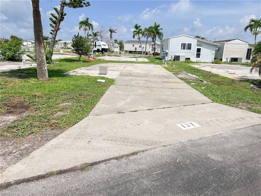 This beautiful lot is in a great location - close to the community pool, clubhouse, Tennis Courts and many other community amenities. Embrace the warm weather and sunshine at Palmetto Palms RV 55+ Condo HOA where you own the land!. Park your RV or place a new manufactured home on this 37x58x36x59’ lot! SELLER IS PAYING THE ONE-TIME ASSESSMENT OF $1800.  So many activities to enjoy like dancing, bingo, cards, pickleball, shuffle board, volleyball, horseshoe pits, and a community walking path/bridge over the lake. Palmetto Palms also offers boat storage and is biking or walking distance to Bunche Beach. The community sustained damage from Hurricane Ian and is in the process of rebuilding common areas and amenities. Water, Sewer, Cable and Electric available in the community. Close to FMB and Sanibel beaches, restaurants, and all this area has to offer. The community and facilities suffered storm damage, but the rebuilding process has begun! More photos coming soon.