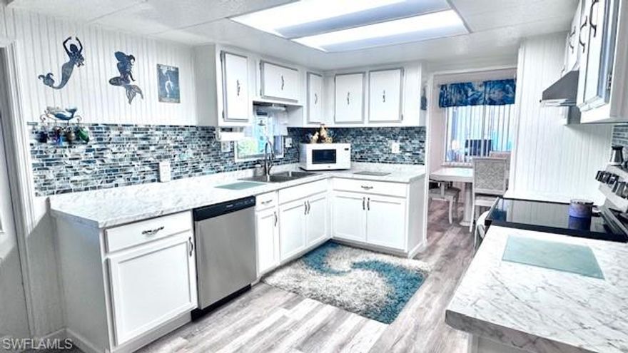 Welcome to your dream home in Old Bridge Village! This beautifully furnished 2-bedroom, 2-bath manufactured home offers 1,352 square feet of thoughtfully designed living space with stylish upgrades throughout. The inviting interior features stainless steel appliances, a decorative backsplash, and a custom vanity in the primary bathroom. The spacious layout is ideal for both entertaining and everyday living.  Enjoy the convenience of in-home laundry, walk-in showers, and an enclosed lanai perfect for relaxing and enjoying the Florida lifestyle year-round. Step outside to a second screened lanai with beautiful landscaping which includes fruit trees, creating a peaceful and private outdoor retreat. Ideally located just steps from the community pool, this home offers both comfort and convenience in a desirable setting.  With elegant finishes, serene surroundings, and move-in-ready appeal, this home is a must-see. Schedule your private showing today and experience all that Old Bridge Village has to offer.
Old Bridge Village, is a friendly, 55+ resident owned community right off the Caloosahatchee River and Gulf Access with lots of amenities, activities all year, clubs and entertainment.  There is a resort style brand new Salt-water  heated pool and hot tub, fitness center, recreation center, bocce ball, pickleball, shuffleboard, tennis, basketball, putting green, horseshoe pits, community clubhouse, fishing pier, kayak and boat launch and an 81 slip marina.   Drive your golf cart around the community, to and from your activities or to Palm Point where you can fish, have a picnic, watch the boats or just enjoy the sunset.  This community is a hidden gem with just minutes by boat or car to downtown Ft. Myers and right between 2 airports with approximately 30 minutes to both Southwest Florida International Airport and Punta Gorda Airport.