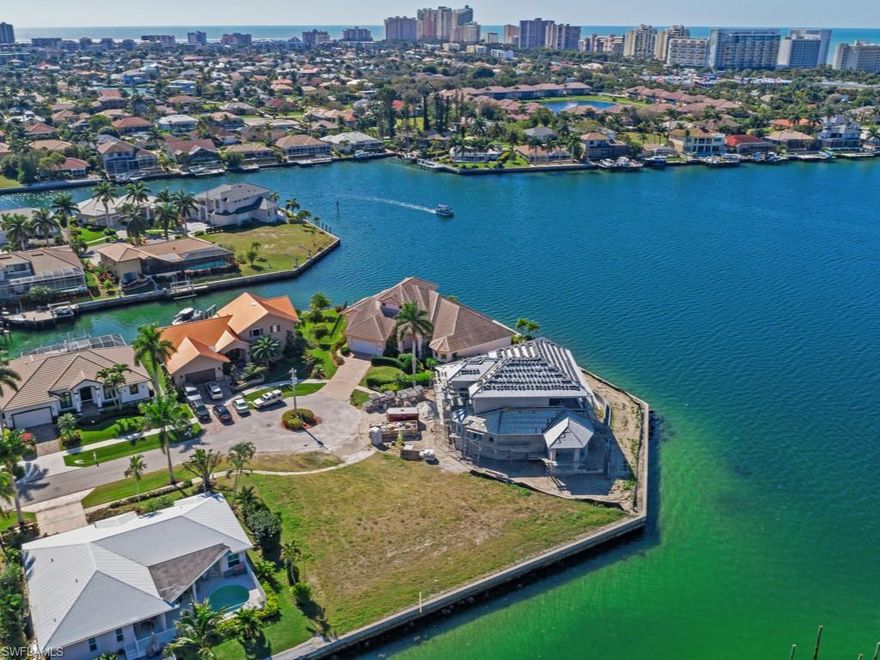 Phenomenal opportunity to purchase a cleared extra large KEY LOT with 140 feet of waterfront and newer seawall! Awesome views of the gorgeous Landmark waterway and quick boating access through Caxambas pass to the Gulf of Mexico! Lovely upscale cul-de-sac neighborhood with beautiful newer homes. Centrally located near the beach, dining, shopping and more!