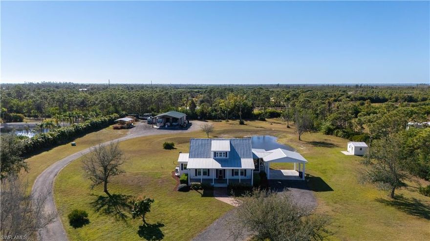 Welcome to 4093 Sunshine Boulevard, a truly exceptional custom-designed and built home by Stearns Custom Builders in 2016, offering the quality, craftsmanship, and thoughtful design of a new custom build—without the wait. Built to code and carefully constructed with longevity in mind, this home has remained high and dry with no hurricane damage, providing peace of mind and long-term confidence.

Situated on 5 beautiful acres, this property delivers the perfect blend of privacy, functionality, and the relaxed Pine Island lifestyle. Designed for both everyday living and entertaining, the home is complemented by a detached red iron steel barn, ideal for storing boats, RVs, equipment, or all of your favorite toys.

Inside, the home showcases distinctive custom finishes and high-end upgrades that set it apart. The kitchen is a true centerpiece, featuring a barnwood kitchen island, reclaimed wood countertops, and commercial-grade, high-end appliances, including a Wolf range and a second oven—perfect for hosting, holidays, or the passionate home chef. A whole-home generator with 400 gallon propane tank adds an additional layer of comfort and security, ensuring seamless living year-round.

Adding even more versatility is a charming She-Shed with a mini kitchen (some items do not convey), ideal for a home business, creative studio, guest retreat, or private escape.

Enjoy the freedom and possibilities that come with five acres of land, offering room to roam, expand, or simply enjoy the peaceful surroundings. Located just minutes from multiple boat ramps, this home is perfectly positioned for those who love life on the water. Pine Island is a renowned fishing community, offering easy access to both inshore and offshore fishing and some of Southwest Florida’s most pristine waterways.

If you’re searching for a one-of-a-kind custom home, premium craftsmanship, space for your lifestyle, and quick access to boating and fishing—all in a laid-back island setting—4093 Sunshine Boulevard is a rare opportunity you won’t want to miss.