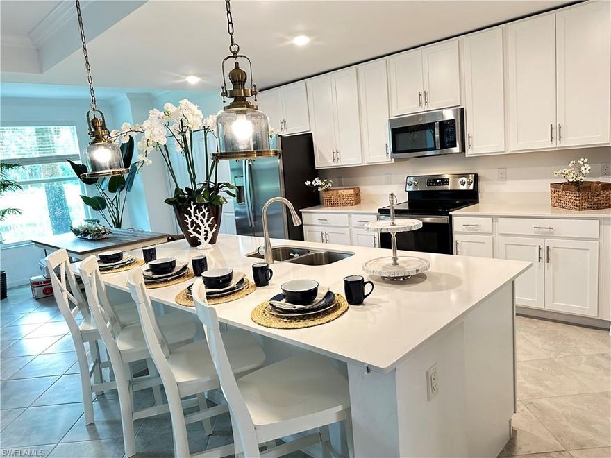 Exclusive Golf membership included with this lake front home!  First floor unit featuring 2 bedrooms +Den / 2 baths and 1 car garage next to the unit. Ready to move in. Diangelo II floorpan!
This unit has amazing views of the lake and view to the 14th hole of the prestigious golf course.
The National Country Club is a gated community with 24hr security patrol. It offers true country living with full spa, gym, pool, restaurants, pickleball, tennis courts, tiki bar and more.
 Upgrades include crown molding, custom window treatments, custom Glass shower enclosures.
Ave Maria is a blue zone, small town with festivals, parks, grocery, fuel and healthcare options.
Live longer with a healthy lifestyle.