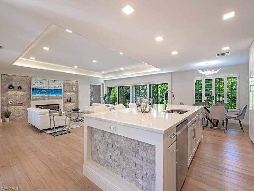 Tucked away in a quiet, four-residence enclave, this beautifully reimagined top-floor 2 bedroom, 2 full bath home places you at the center of everything Olde Naples has to offer—just a short stroll to the beach, the Naples Pier, and the charming boutiques and restaurants of Third Street South.

Inside, the home has been completely transformed with a refined, modern aesthetic. Soaring, tray ceilings and an open layout create an inviting sense of space, while oversized windows frame the lush Rodger Park views on one side, complimented with a serene, tropical courtyard and pristine pool on the other.

Every element has been curated with care—from rich wide-plank Legno Bastone French white oak hardwood flooring and custom millwork to a striking LED fireplace and a show-stopping kitchen with premium finishes and a generous island for entertaining.