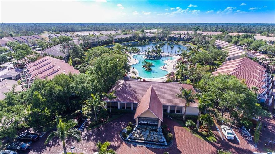 Serene garden with water feature and partial lake view-must see!  You won't want to miss this one. Priced to sell. One Year Home Warranty Included! Hurricane assessment paid! Electric roll down hurricane shutters! Enjoy a tranquil setting in the active and vibrant community of Falling Waters! Just 15 minutes from beaches and 5th Avenue South, this 2/2 condo boasts large space with vaulted ceilings and lots of light. The extra large lanai has been upgraded with an outdoor kitchen with granite counter and 18" ceramic tile on the diagonal with a custom mosaic. Extremely well maintained.  Falling Waters has a stunning resort style pool and newly re-designed clubhouse with a full time activities director.