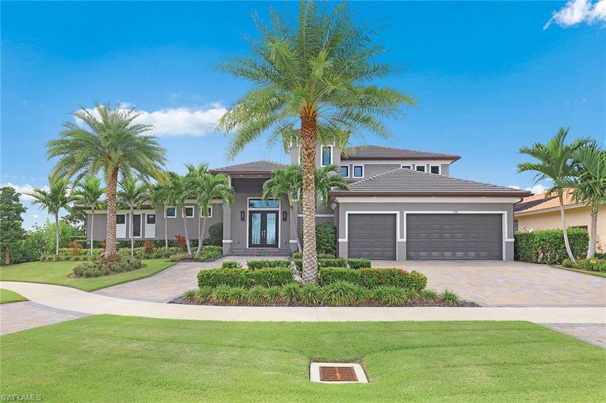 Relax and enjoy beautiful sunsets from this stunning four-bedroom custom home built in 2017. This exquisite contemporary home features two master suites on the first floor, en-suite baths with dual sinks, a bonus room on the second floor with a desk area for remote working, a second-story balcony, second laundry upstairs, Sonos home audio system, whole-house water filtration system, tankless hot water, a gourmet kitchen with custom cabinetry, deluxe appliances and so much more. A few of the exterior features include an expansive outdoor living space with a summer kitchen, infinity-edge saltwater pool and spa, gas fireplace and remote screens/shutters on the lanai. You'll appreciate the ample room for relaxing along the water or around the pool deck while enjoying expansive views of converging waterways. The oversized lot with a circular drive affords plenty of parking. Perfect for entertaining and year-round living. Nothing has been overlooked in this luxury masterpiece. Truly a must-see.