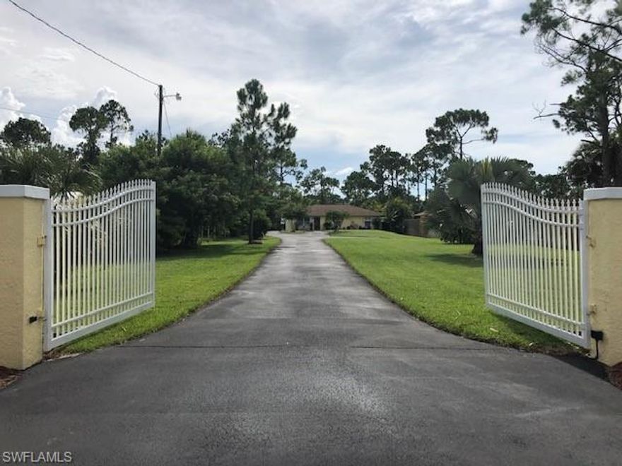 This 3/2  pool home is VERY well cared for and is spotless! The owner  is truly passionate about their property and it shows.   The home has amazing finishes.  From the entry gate entrance and the fully fenced yard to the great OPEN PLAN living space.   This is perfect for someone with a business, a workshop or a studio and yes, there is land!  Comes with a huge outbuilding that has electricity already and even a clearing complete with a fire pit.  You can accommodate multiple vehicles and drive all the way to the back on the paved driveway.  Plenty of room to park or turn around.   Also, everything is in NEW CONDITION.  NEW Kitchen with Granite counter tops, stainless steel appliances, new custom flooring, updated bathrooms and much more.  And most importantly...It's CLOSE IN! This property is located WEST of 13th St SW (Library Street) Super location! Priced low for a quick sale...come and see it today. Only 6  miles to I-75, 10 miles to the beaches. You can't beat this one.. come see for yourself all of the custom touches the owner has put into it!