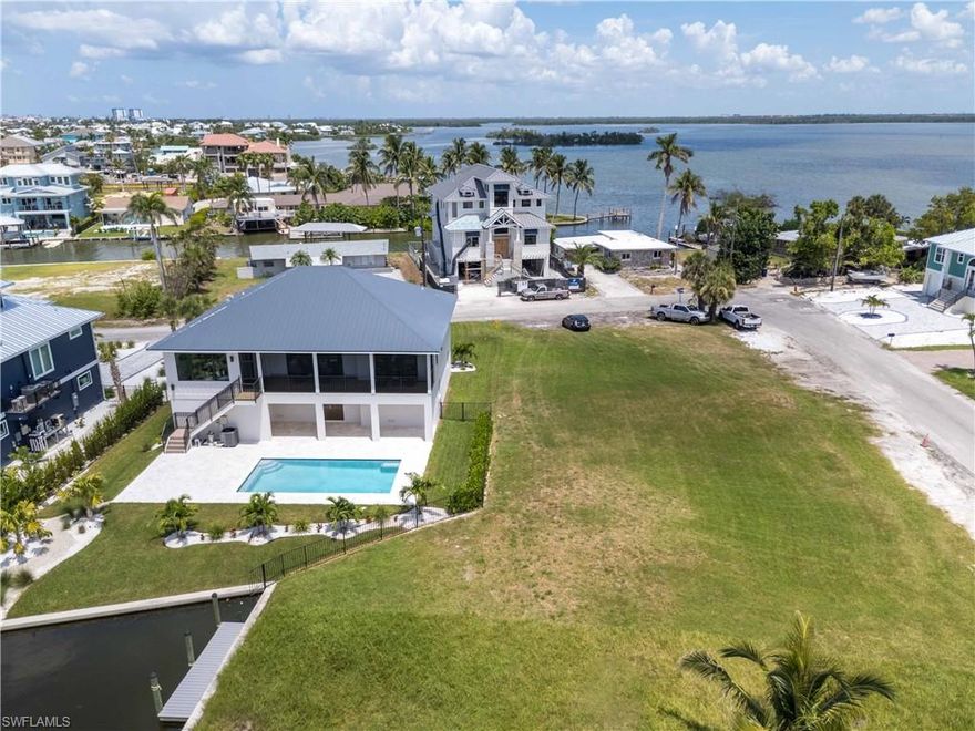 Nestled in the vibrant heart of Fort Myers Beach and situated in the prestigious community of Fairview Isles, this stunning waterfront property offers a unique blend of tranquility and convenience. Imagine stepping out of your gorgeous new residence, set on over 1/3 acre of prime land, and being greeted by breathtaking views of the Bay and beautiful homes built around you. With deeded beach access and just a short stroll away from sun-drenched sands, this haven provides the perfect balance of seclusion and access to nature's wonders. Boasting direct Gulf access and proximity to Estero Bay, you'll find endless opportunities for boating and some of the best fishing that SW Florida has to offer. With this oversized property, you can create your own sanctuary with a clean slate to work with. Despite its serene setting, you're minutes away from a variety of shopping, dining, and entertainment venues, ensuring that the buzz of city life is always within reach. With room to spread out and create your dream home, this enchanting locale is perfect for those seeking a harmonious blend of luxury and lifestyle.