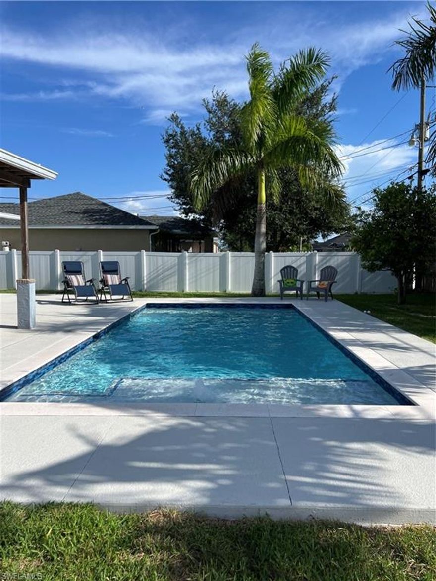 Your winter retreat is currently available NOVEMBER AND DECEMBER 2025 and summer months starting May 1, 2026 at reduced rate! A fenced backyard oasis for your whole family to enjoy! Beautiful New heated, saltwater pool with shallow sun deck and fountain. Kids and doggies will love this  home that features a huge fenced yard, paved patio for games along with a hot tub and outdoor bar and grill.  After enjoying the local beaches, Sun-splash water park, art galleries and shopping, come home to a quiet neighborhood to enjoy the sunsets. This home offers an open concept with three bedrooms and two baths. A large circular driveway offers lots of parking along with the double garage. Fully furnished and turn key with everything you will need. An extra refrigerator and freezer in the garage along with bikes to cruise the neighborhood.