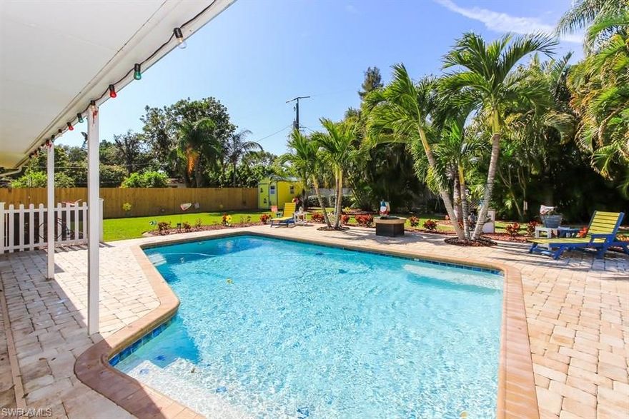 This Beautiful home is in pristine condition with nothing overlooked.   Absolutely Perfect Move In Ready. Roof 2008, AC 2015 Gorgeous newer kitchen with custom cabinets and quartz counters, Kohler farmhouse sink and faucet, Allure vinyl flooring on diagonal throughout, tile in totally updated baths, 5 1/4" baseboards, custom lighting and Plantation Shutters on living room and bedroom windows.
 Two sets of double pane French Doors  open to Spacious Patio and pool area overlooking  your own  charming whimsical paradise on oversized lushly landscaped fenced yard.  Large heated renovated pool with roll away cover, extra covered area perfect for man cave or a planting area with rain barrel.  Shed for extra Storage and lighting on some patio trees. Pool has a salt chlorination system and electric heater.   Driveway has new pavers and was widened. Utilities have been moved underground, new well system for irrigation system.  Does not require flood insurance.
Make sure to check out attached list of all the improvements and upgrades on this incredible property.