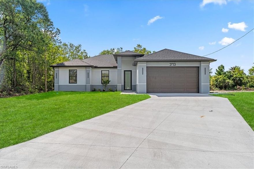 Welcome home to this stunning New Construction 3-bedroom, 2-bathroom residence in a flourishing area of Lehigh Acres. The open-concept design creates a bright and airy atmosphere, centered around a flawless kitchen that boasts elegant wood cabinets, sleek quartz countertops, and a full suite of brand-new stainless steel appliances. Safety and serenity are ensured with impact windows and doors installed throughout. Every corner radiates modern style with gorgeous porcelain tile underfoot. This move-in-ready property requires zero updates, offering the perfect, low-maintenance sanctuary. Call now for a private showing!