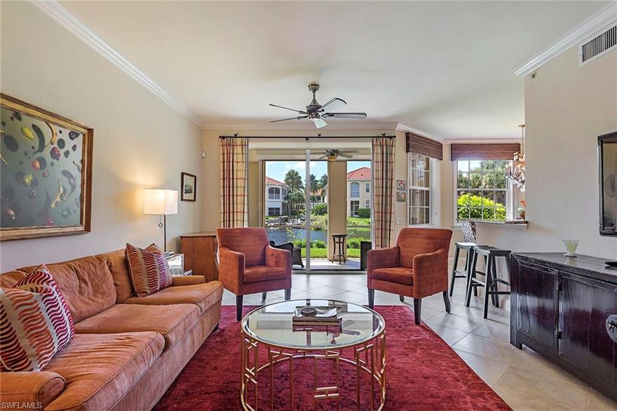 Absolutely gorgeous, custom remodeled, lakefront residence in the highly sought after L'Ambiance at Pelican Bay. Nestled in a private cul-de-sac location with preferred southern exposure, this 1st floor designer-finished condo features a redesigned gourmet kitchen including Viking appliances and gorgeous granite and custom wood cabinetry, marble and granite baths with luxury appointments, solid core doors, crown molding, hardwood flooring, closet built-ins and electric shutters on the lanai and rear windows. The interior flows effortlessly to the covered lanai where a grill center with granite top can be found and peaceful lake views. A private attached garage completes the package! L'Ambiance offers a beautifully finished clubhouse including fitness room and private pool. Private membership included at both of Pelican Bay's private beach restaurants and Community Center featuring a state-of-the-art fitness center and a very active tennis program.