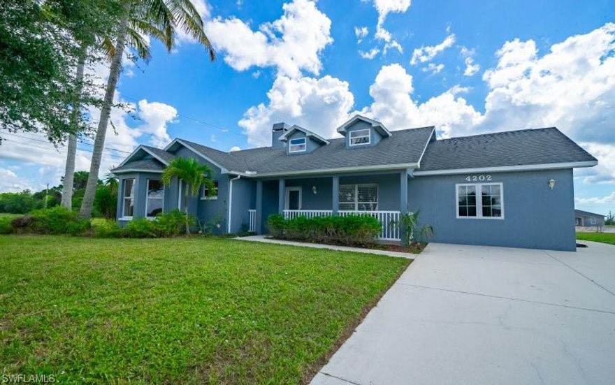 It doesn't get any quieter than this freshly remodeled 3/2 pool home just west of Old Burnt Store Rd. New paint, new floors throughout, new appliances, solid wood cabinets with granite tops, custom guest and master baths, new A/C and a beautiful architectural shingles roof! This wonder home is open but still cozy with plenty of room in the community area and a fire place. Relax on the front porch or back patio poolside, read a book in the enclosed sun room. The converted garage is ready for a pool table or play area. Close enough to all the things you need but far enough away from all the things you don't.