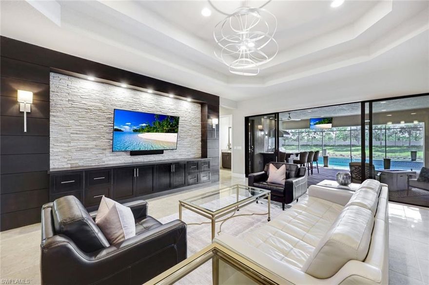 Welcome to the Highly Coveted Carlisle Model in StoneCreek. Experience modern Naples living in this sought-after Carlisle Model single-family home offering 3 bedrooms, an expansive den, 3.5 baths, and a 3-car garage. Designed for both comfort and entertaining, this residence blends thoughtful upgrades with effortless indoor-outdoor living.
Inside, you’ll find an open-concept kitchen with a large island, stainless steel appliances, a gas range, and a wet bar perfect for hosting and family gatherings. The primary suite features dual walk-in closets and a spa-like bathroom with dual vanities, a soaking tub, and a separate walk-in shower. Step outside to your own private oasis: an extended screened lanai with a summer kitchen and bar area, ideal for dining al fresco. Enjoy the heated pool and spa, surrounded by lush landscaping and tranquil water views that create a true sense of retreat. Located in the amenity-rich gated community of StoneCreek, residents enjoy access to a modern clubhouse with a fitness center, game room, and social gathering spaces, along with pickleball, tennis, resort-style pools and spa, playgrounds, and more. Just minutes from Naples’ white-sand beaches, fine dining, and upscale shopping, this home perfectly combines elegance, comfort, and an unbeatable location.