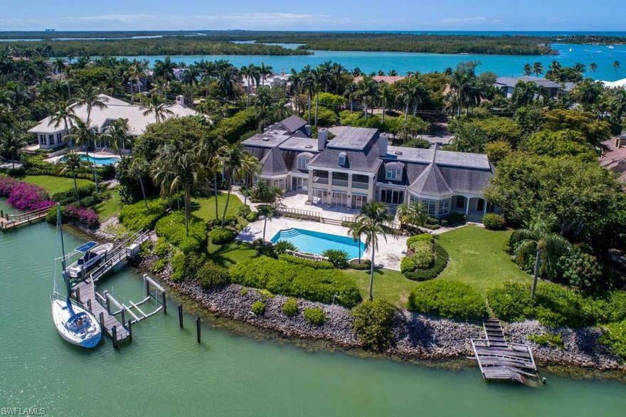 Stunning wide water views from this Legacy Port Royal Estate home. Located on 2 1/4 lots with 250 feet of water frontage. Perfect entertaining home with spacious open living spaces throughout the home, breathtaking water views from nearly every room, built in bar, large breakfast room, formal dining room and 8 large bedrooms with en suites. This property checks every box for luxurious coastal living in the prestigious community of Port Royal.