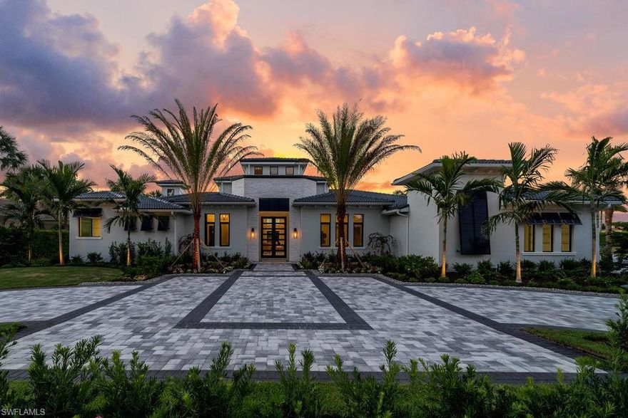 This newly rebuilt 2020 custom estate was designed by Clive Daniel and is situated on an oversized lot offering serene lake & golf course views. Spread over almost 5,000 SF of living space, there are 4 bedrooms plus a den with 5 full baths & 1 half bath. Numerous new upgrades include a large glass front door, quartz and granite counter tops, pristine wood and marble flooring, notable light & bath fixtures, extensive crown molding & wood trim, recessed ceilings with wood beams, Lutron lighting system, custom built-ins, his/her closets and baths in the master & more. The custom chefs kitchen features a double center island with a farm sink, a Wolf appliance package with a 8 burner range, pot filler, & wet bar. Additional upgrades include PGT hurricane-impact windows and doors, new water heater, updated AC units in the last 5 years, a roof replaced in 2016, & a 3 car garage with epoxy flooring & room for storage The oversized lanai has a custom pool complete with fiberoptic lighting, raised spa with water feature, deck jets, new pool equipment, a freestanding fire pit with seating & an outdoor kitchen. This home must be seen to fully appreciate the quality & craftsmanship throughout.