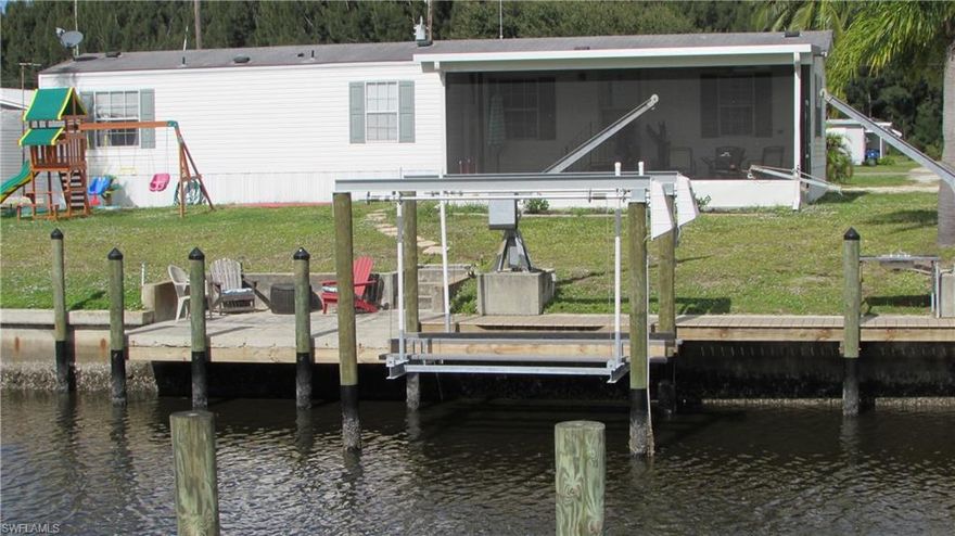 TWO HOMES FOR THE PRICE OF ONE. Two well maintained homes with Gulf Access. The homes are on a lot in Flamingo Bay that is street to canal and quick access to Pine Island Sound and the Gulf. The 2005 built, 960 sq ft has 2 bedrooms, 2 baths, open floor plan, screen porch and views of the water. Brand new dock, 7000 lb boat lift, new range and dishwasher. The 2 bedroom 1 bath home with a screen porch was rebuilt in 1974, 672 sq ft, new A/C, washer & dryer, new flooring and freshly painted. 2 car carport in between homes along with a shed. These homes can be investment property, weekend homes for you and friends/family--Plenty of Room for Everyone.