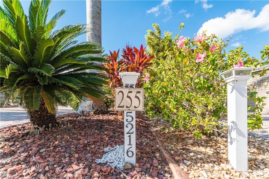 Welcome to Lot 255, a beautifully improved 35’ x 90’ lakefront pavestone lot located in the highly sought-after Cypress Trail RV Resort and walking distance to amenities. This exceptional property offers stunning water and fountain views, mature tropical landscaping for added privacy, and multiple upgraded outdoor living features.

Enjoy the best of Florida living under the spacious tiki hut, perfect for relaxing or entertaining while taking in tranquil lakefront scenery. The property includes a built-in outdoor kitchen with grill, prep space, and storage, making outdoor dining effortless. A large open patio provides plenty of room for seating, sunbathing, or gathering with friends.

The finished 8’ x 15’ shed is equipped with tile flooring, a mini-split A/C, a sofa sleeper, shelving, and a refrigerator—ideal for guests, hobbies, or extra storage. The shed also includes a bathroom with a toilet and sink for added convenience.

Additional upgrades include expansive paver work, lush landscaping, outdoor seating areas by the water, and close proximity to all resort amenities.

Cypress Trail RV Resort is a gated community offering top-tier amenities including a clubhouse, pool and spa, pickleball and tennis courts, dog parks, fitness center, community events, and more.

This lot offers the perfect blend of comfort, privacy, and resort-style living—your ideal Florida retreat.