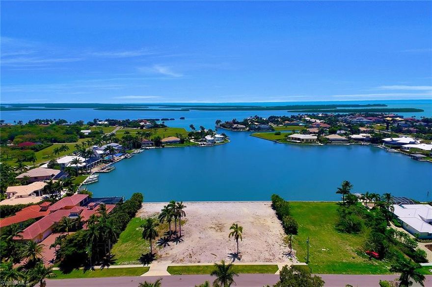 Rarely does an opportunity like this come along. These two estate lots with southern exposure on Fredrick's Bay offer fast and easy direct access to the Gulf of Mexico with beautiful open wide water views. A perfect location to build your large custom dream home where the possibilities are endless. Brand-new seawalls are being installed at time of listing. Previous home has just been removed so the new buyer may receive impact credits on building. Current lot size is 250x175x250x175.  Seller will consider selling each lot separate.