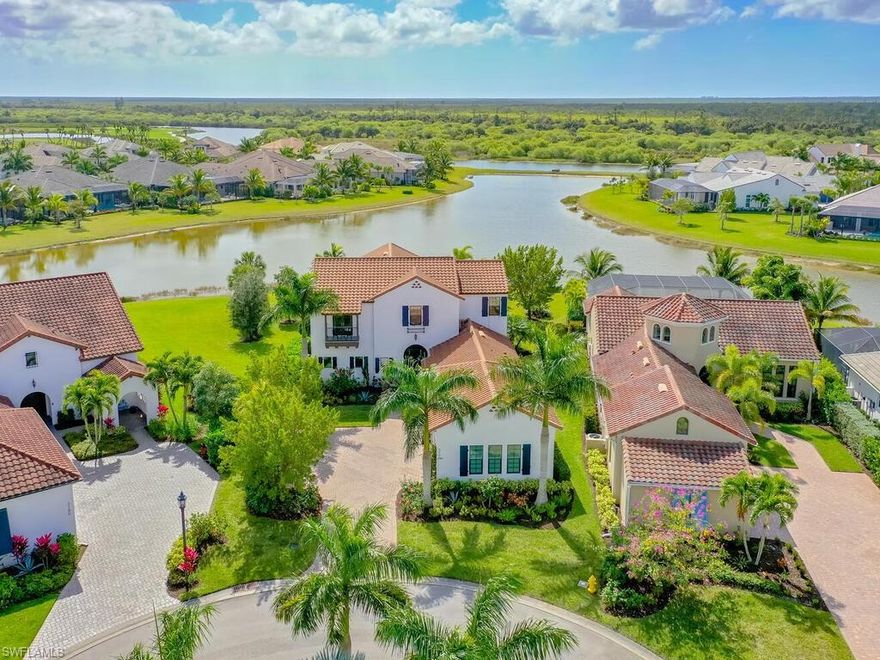 Welcome to paradise. This stunning Ashton Woods designed home has been significantly enhanced at every turn. With over 4,000 square feet under air, this home is spacious, elegant and comfortable. This open concept home has vaulted ceilings throughout and presents a very warm and inviting home. All furnishings are tastefully presented by Clive Daniel. The home sits on a beautiful cul-de-sac lot with sprawling water views. The oversized lanai is terrific for enjoying the beautiful weather here in Southwest Florida. The lanai is complete with a resort sized swimming pool, a hot tub and a beautiful built-in outdoor kitchen. This home has many significant upgrades including an oversized 3 car garage, impact glass, whole house Generac generator, Italian made custom cabinets, complete with under and over cabinet lighting and a brand new backsplash in the kitchen. The home has a built-in bar complete with a wine fridge. The oversized first floor primary bedroom was upgraded with beautiful custom closets. No detail has been overlooked in this home as it also comes with customized landscaping. The CDD is paid in full. 3190 Cotuit is conveniently located close to the Club and Spa.