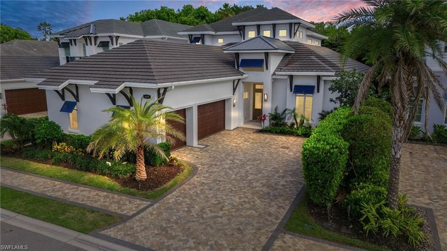 Exquisite Coastal Luxury in the heart of Naples!  Discover unparalleled elegance in this stunning 2021 built “Sea Breeze II" residence by Seagate Development, located in the exclusive gated enclave of Windward Isles in Naples, FL. This coastal-inspired masterpiece boasts over 4,200 sq. ft. of thoughtfully designed living space, featuring 5 bedrooms, 5.5 baths, a study and a loft. Step inside to breathtaking designer finishes, including a grand mahogany front door, soaring ceilings, white oak flooring, and an open glass staircase. The expansive great room flows seamlessly into the gourmet kitchen, adorned with Quartzite Taj Mahal countertops, Thermador appliances, a gas range, Thermador climate controlled wine fridge and two dishwashers. Pocketing WinDoor sliding glass doors lead to an outdoor oasis, complete with a summer kitchen, putting green, gas fireplace, saltwater pool, and artificial turf for a resort-like ambiance. This smart home is equipped with a Control4 automation system, Lutron lighting, surround sound, built-in speakers, security cameras, and remote-controlled roller blinds. For ultimate comfort, enjoy 3 independent AC systems, hurricane impact windows & doors, a garage mini-split AC, a REME HALO® air purifier, and UV-treated air filtration. A 26kW Generac generator with a 500-gallon gas tank ensures uninterrupted luxury living, while a Tesla charger in the 3-car epoxy-finished garage adds modern convenience. Additional refined touches include tray ceilings, LED-lit mirrors, premium cabinetry, frameless shower enclosures, and a freestanding tub in the primary suite. Built with Andersen impact windows, spray foam insulation, and soundproofing, this home offers both beauty and durability. A true sanctuary of sophistication, this Windward Isles estate blends coastal charm with cutting-edge technology and luxury finishes—offering the finest in Naples living. Windward Isles is an exclusive 28 home gated community minutes away to access The Ritz Carlton, Waterside Shops, Naples Grande Beach Resort, Mercato, and a tropical landscape of additional beaches and world-class golf courses. This home has it all! Claim your slice in paradise today!