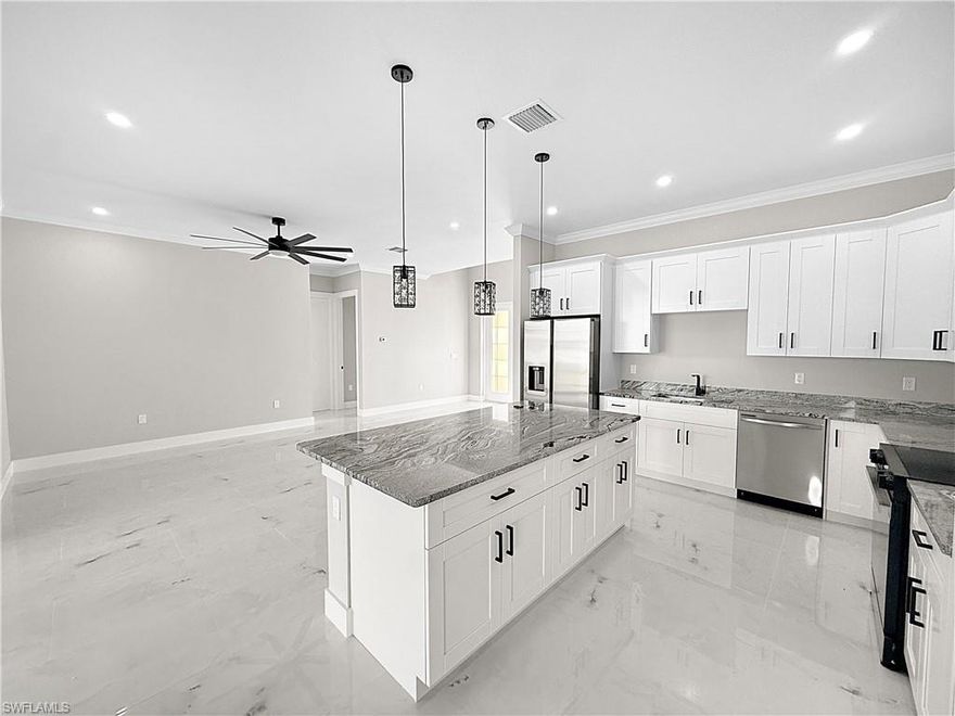 Be the first to live in this brand-new construction home located at 303 NW 26th Ave in Cape Coral. This 3-bedroom, 3-bathroom residence features a modern open-concept floor plan with high ceilings and oversized doors, creating a bright and spacious interior.
The home offers a well-designed layout with generous living and dining areas that flow seamlessly into the kitchen, making it ideal for everyday living and entertaining. Each bedroom is comfortably sized, and the presence of three full bathrooms provides added convenience and privacy for occupants.
Additional features include contemporary finishes throughout, abundant natural light, and a clean, modern design. As new construction, the property offers the benefit of being move-in ready with no prior occupants.
Conveniently located in a quiet Cape Coral neighborhood with close proximity to shopping, dining, schools, and major roadways.