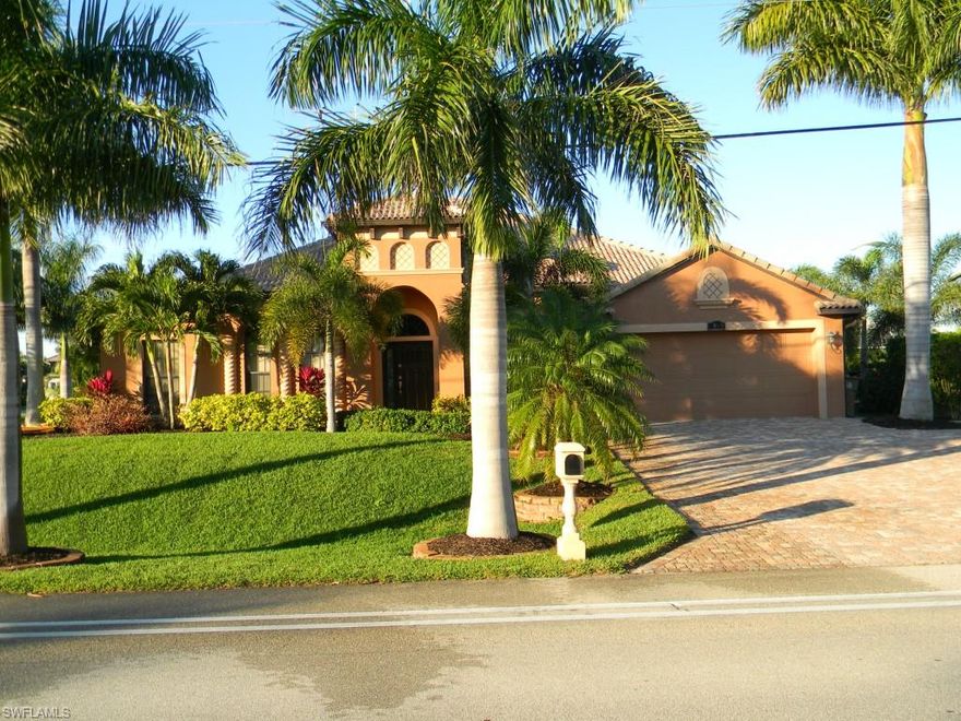 LOCATED IN MOST DESIRABLE AREA IN CAPE CORAL . Within walking distance to Rum Runners and Cape Harbor Marina . Real wood floors . Travertine tile in all bath rooms and laundry room . Built in safe . All stainless steel appliances including wine cooler . Crown molding throughout . 42" Cherry wood cabinets in kitchen . Granite counter tops . Steam room . Walk in closets . Separate shower and jetted tub in master bath . 1/2" glass shower doors in all bathrooms (MR. SHOWER DOOR) . Stereo speakers with individual controls throughout . Monitored alarm system . Trayed ceilings . All solid wood six panel doors throughout . Leaded glass french doors in office . Garage has cabinets with extra storage space . Screened lanai with heated salt water pool and spa . Outdoor kitchen . Corner lot with beautiful landscaping.