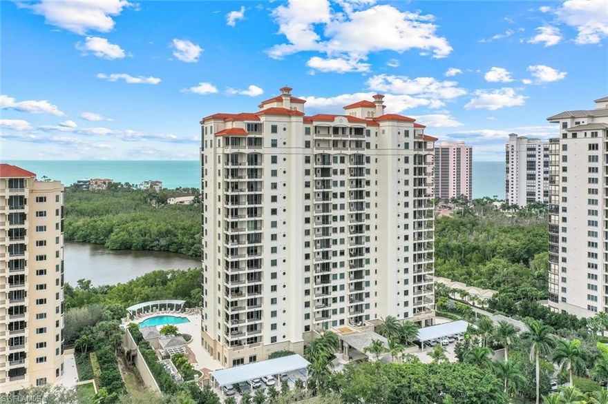 Introducing a rare gem in the prestigious Toscana at Bay Colony: an 11th-floor '01' end unit that is highly coveted and rarely available. This exquisite residence spans an impressive 2,800 square feet of living space under air, extending to a total of 3,570 square feet with expansive lanais. It features 3 bedrooms, 3 full baths, and boasts breathtaking Gulf, Bay and City views. The unit is accessed via a secured elevator opening directly into your foyer, emphasizing exclusivity and privacy. The open floor plan extends into spacious living areas, adorned with beautiful flooring, custom built-ins, and elegant moldings. Two expansive wraparound lanais and two deeded parking spaces enhance the appeal. Revel in stunning views of the Gulf, bay, and captivating sunrises and sunsets. This residence is moments from the private Bay Colony Beach and tennis clubs, with membership included, ensuring a lifestyle of unparalleled luxury and convenience.