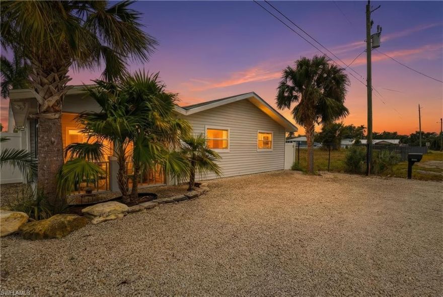 """This could be your view...every...single...day!*** What are you waiting for?
Turnkey Gulf-Access Cottage – Ultimate Florida Lifestyle!

Darling 2 bed / 2 bath cottage on the North end of Pine Island—completely turnkey, just move right in! Ideal for boaters & anglers with a 24,000 pound covered boat lift, fast access to Shell Pass, Pine Island Sound & Charlotte Harbor, and located in one of the best fishing destinations in the country.

Enjoy a fenced backyard overlooking a large private boat basin, beautiful sunrises & sunsets on the water, plus plenty of room for parking due to the double gate for  trailers, toys—or even a future pool. Recent improvements include NEW septic system, new pavers in the back yard, and a NEW water heater for peace of mind.

Large lot, ultra low-maintenance yard, and surrounded by pure island fun—tarpon, snook, trout, mackerel & more await.

Whether you want to fish, relax, escape, or invest, this is the ultimate island getaway. Come make the Florida dream yours!  Don’t miss this rare Bokeelia treasure!