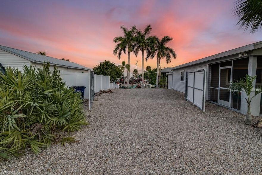 """This could be your view...every...single...day!*** What are you waiting for?
Turnkey Gulf-Access Cottage – Ultimate Florida Lifestyle!

Darling 2 bed / 2 bath cottage on the North end of Pine Island—completely turnkey, just move right in! Ideal for boaters & anglers with a 24,000 pound covered boat lift, fast access to Shell Pass, Pine Island Sound & Charlotte Harbor, and located in one of the best fishing destinations in the country.

Enjoy a fenced backyard overlooking a large private boat basin, beautiful sunrises & sunsets on the water, plus plenty of room for parking, trailers, toys—or even a future pool. Recent improvements include NEW septic system & NEW water heater for peace of mind.

Large lot, ultra low-maintenance yard, and surrounded by pure island fun—tarpon, snook, trout, mackerel & more await.

Whether you want to fish, relax, escape, or invest, this is the ultimate island getaway. Come make the Florida dream yours!  Don’t miss this rare Bokeelia treasure!