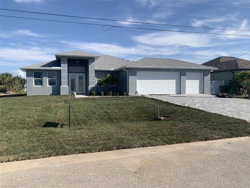 ---- Brand New Gulf access POOL home and 3 CAR garage with an estimated completion date C/O 2-22-23. ( Pool cage completed 12-12-22)    This home is loaded with all the goodies and upgrades!!!  Impact glass and new Hurricane codes with concrete block walls make this home like a safe small castle. The kitchen offers high-level quartz counters, custom tile backsplash, stainless appliances, and white cabinetry.  Bathrooms are loaded with upgrades, too! Designer tile and neutrally painted throughout.  This home is located on the amazing Saltwater Armstrong canal in sought-after unit # 92, enjoy water views from the huge lanai featuring a gorgeous pool!   City water and sewer assessments are paid in full.  Added bonus,  this home can be bought partially furnished. AVAILABLE IN THE CAPE WITH A 3 CAR GARAGE ON GULF ACCESS -