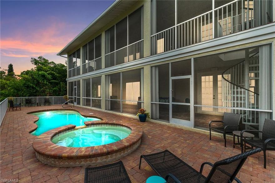 Fully custom three-level Marco Island estate situated on a rare 0.6-acre double lot, offering 5,031 square feet under air, a private elevator, and two double garages with 4-car capacity. Positioned on an elevated hilltop, this exceptional residence captures spectacular panoramic views of Barfield Bay and the Marco Island skyline.

Constructed to commercial-grade specifications, the home features solid concrete construction, a metal roof, and a fire sprinkler system, delivering outstanding durability and peace of mind.

The residence offers five bedrooms with flexible living spaces throughout. The first level includes private guest suites, an entertainment room, and access to the outdoor pool and spa area with a covered porch, creating the perfect space for guests or extended stays.

On the main living level, soaring 22-foot ceilings highlight a grand living room with fireplace, complemented by an open-concept kitchen and dining area, an additional guest bedroom, and a versatile theater/media room or den. A screened porch invites you to relax while enjoying tranquil water and skyline views.

The entire third level is dedicated to the luxurious primary suite, complete with a loft, private library, and breathtaking panoramic vistas.

The beautifully landscaped grounds features butterfly gardens and a fire pit gathering area, all backing to protected mangroves for exceptional privacy and natural beauty.

Ideally located just minutes from Marco Island’s beaches, dining, and shopping, this extraordinary estate offers a rare combination of space, elevation, privacy, and views.